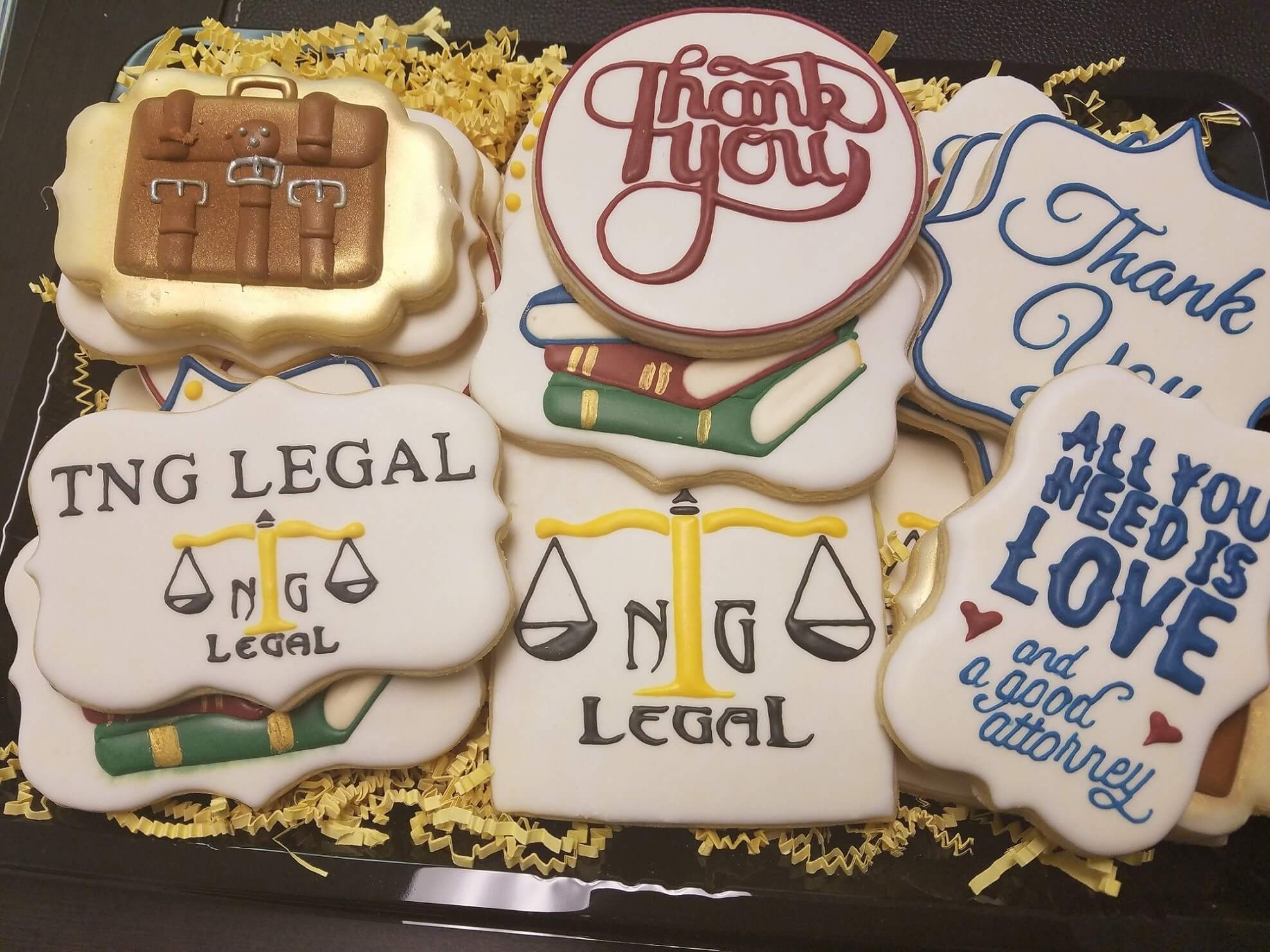 A tray of cookies that say " thank you ".